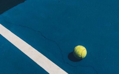 yellow tennis ball on court